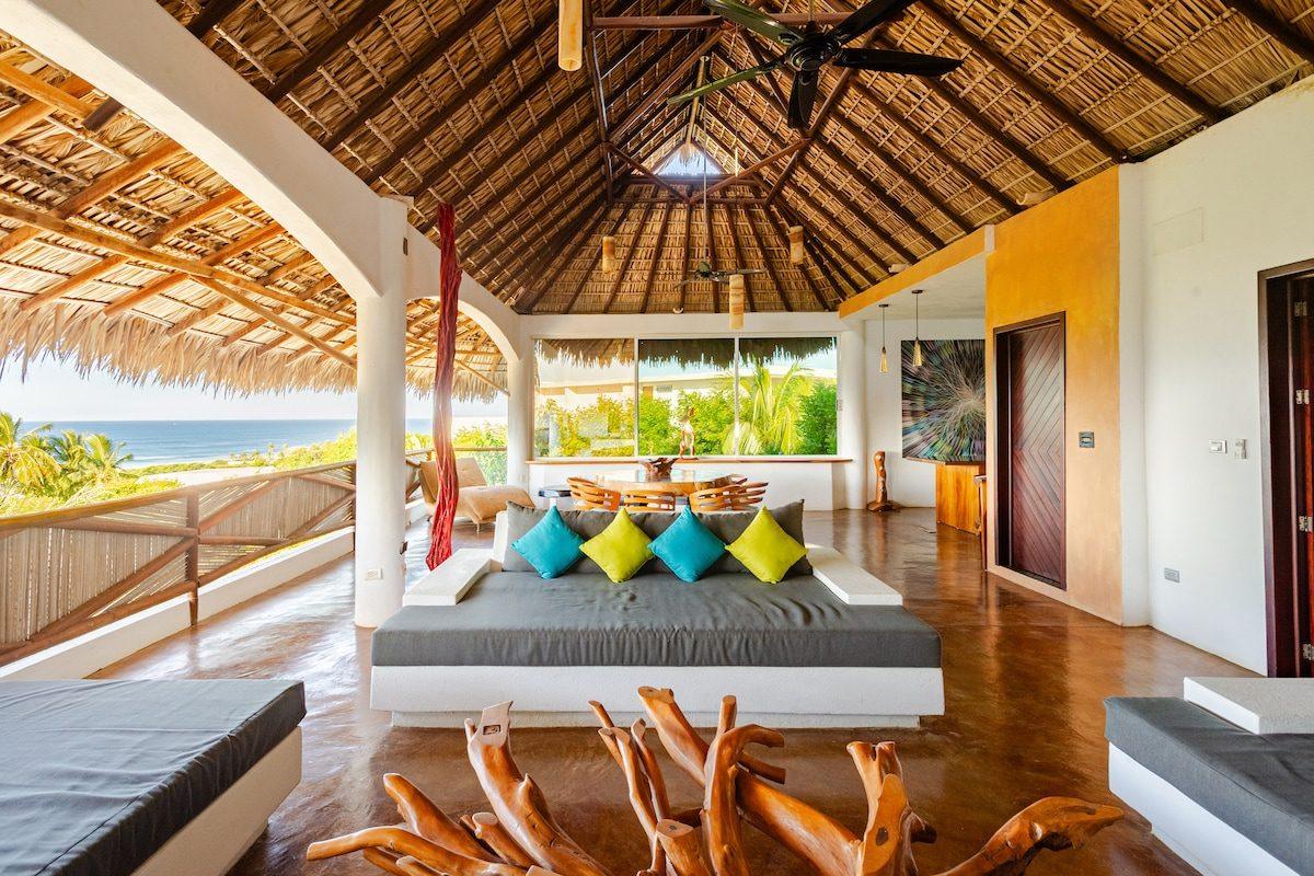 The palapa and shaded seating at Raíz, Tierra en Armonía